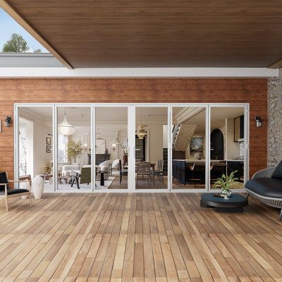 Multi-slide impact glass doors opening to a wood deck
