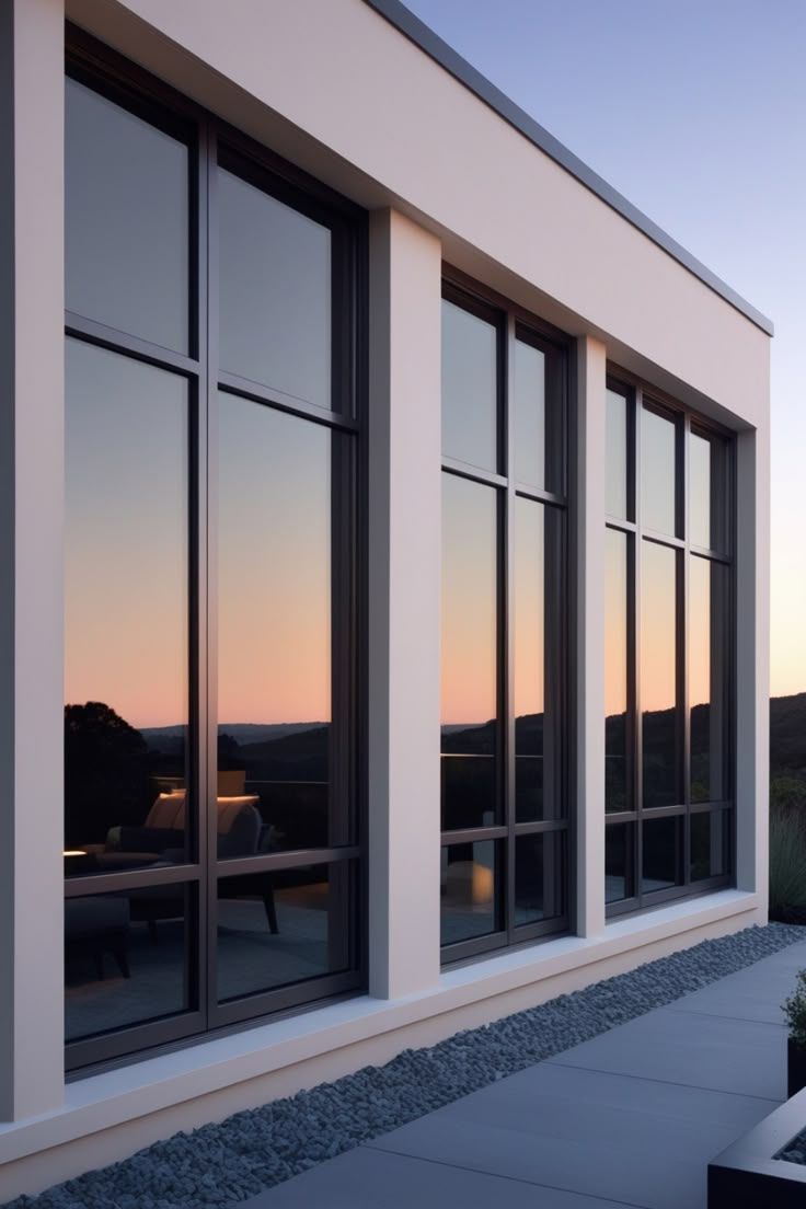 Modern impact windows at dusk, framing a Florida sunset view
